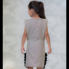 back view of the beige checks the dress for girls 
