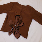 Back view of girls brown top with cutout and satin bow detail with satin lining 