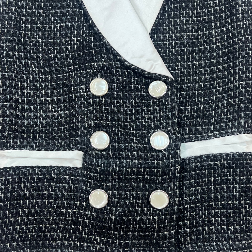 Girls black tweed fabric top with white lapel and pearl button detail