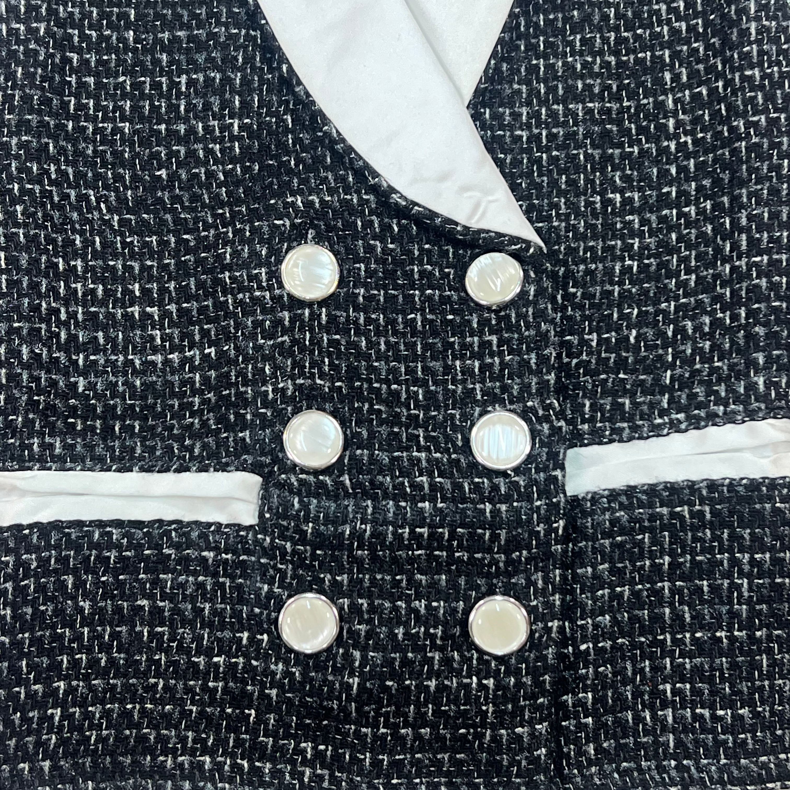 Girls black tweed fabric top with white lapel and pearl button detail
